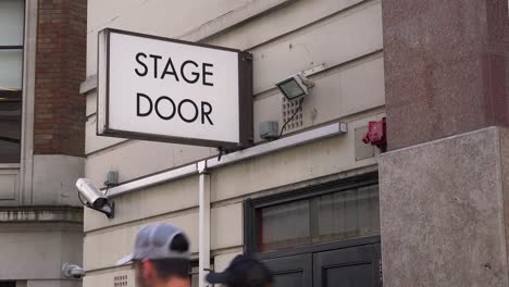 a generic stage door leads actors and performers to the backstage of a local theater in london england 3