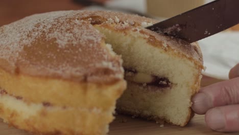 Slicing-into-a-Victoria-sponge-cake-close-up-shot