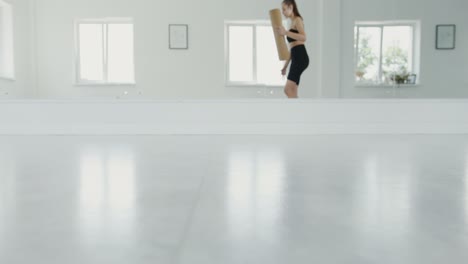 woman doing yoga workout in a studio