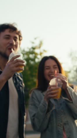 friends enjoying orange juice outdoors