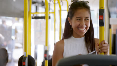 teenage girl with mobile phone standing in the bus 4k