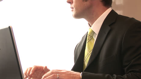 businessman working on a train