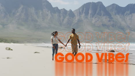 animación de las palabras buenas vibraciones escritas en naranja sobre una pareja de manos caminando por la playa