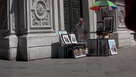 a street artist paints outside a cathedral in paris