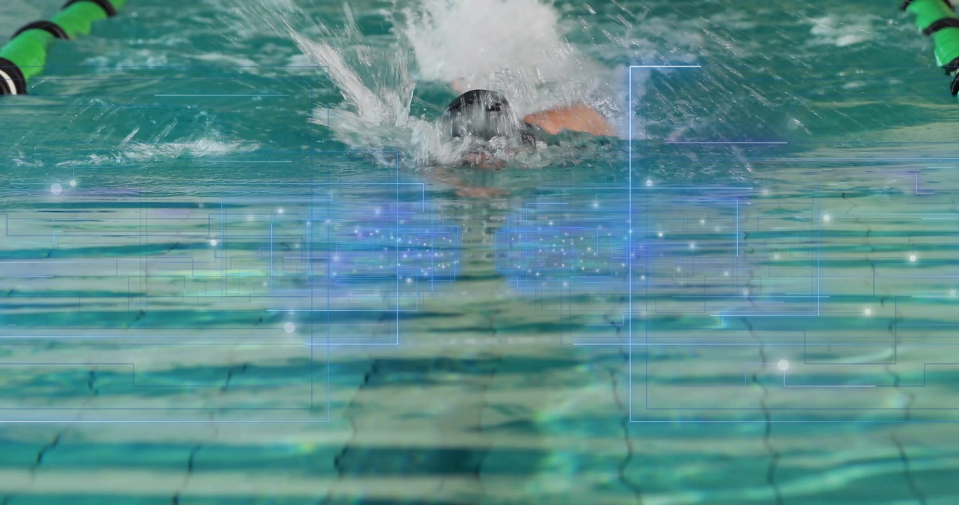 Swimmer emerging from far end and gliding through lane practicing front-crawl stroke for endurance