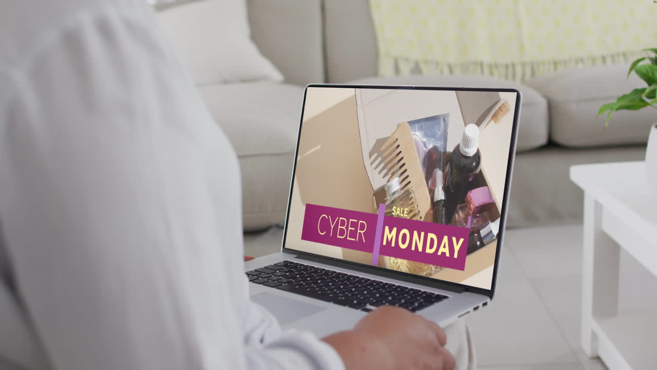 mujer biracial usando una computadora portátil en casa para comprar en línea, cámara lenta