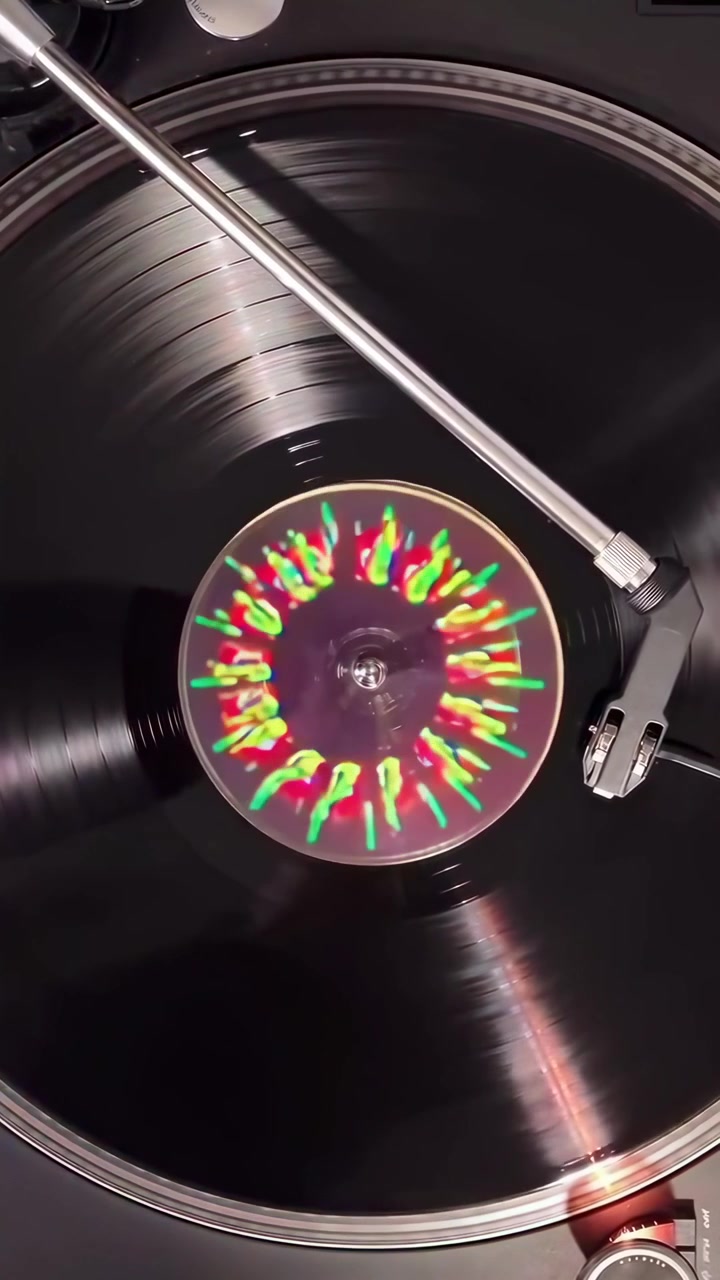 Vinyl Record Spinning with Colorful Psychedelic Light Projections