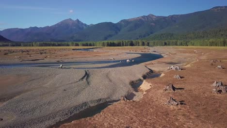 Aerial-flight-over-shallow-streams-that-don't-carry-enough-water-to-form-a-lake-as-not-enough-snow-grew-on-local-mountains-that-feed-Ross-lake