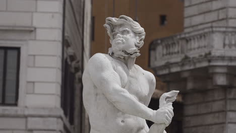 detail of a roman fountain statue