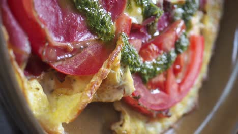 omelette with prosciutto, tomatoes, and pesto