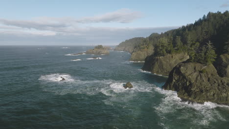 aerial view of a dramatic rocky coastline with waves crashing against the shore