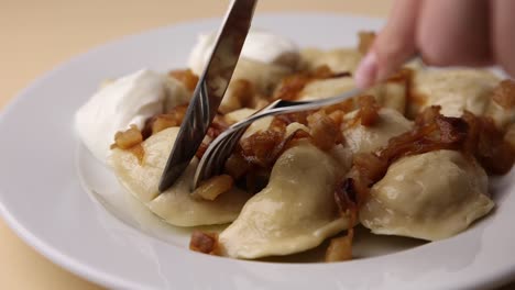 pierogi with sour cream and onions