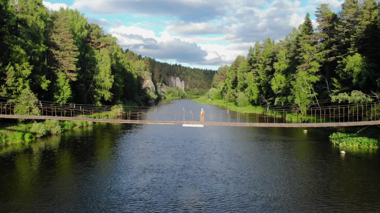 Scenic River Landscape with Suspension Bridge