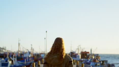 Woman-standing-on-the-dock-4k