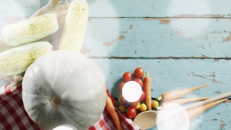 animation of light spots over vegetables on wooden background