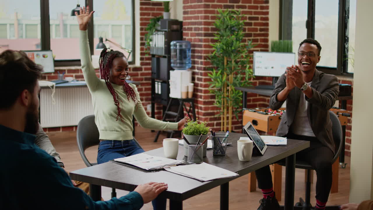 Cheerful business people celebrating successful partnership