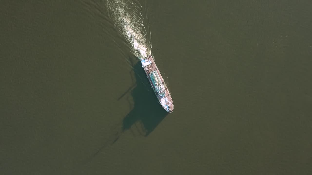 Towing Barge on River