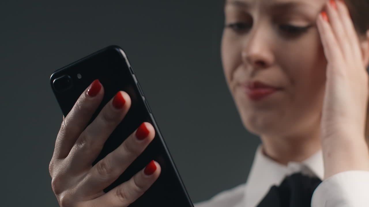 Woman using smartphone, looking at phone