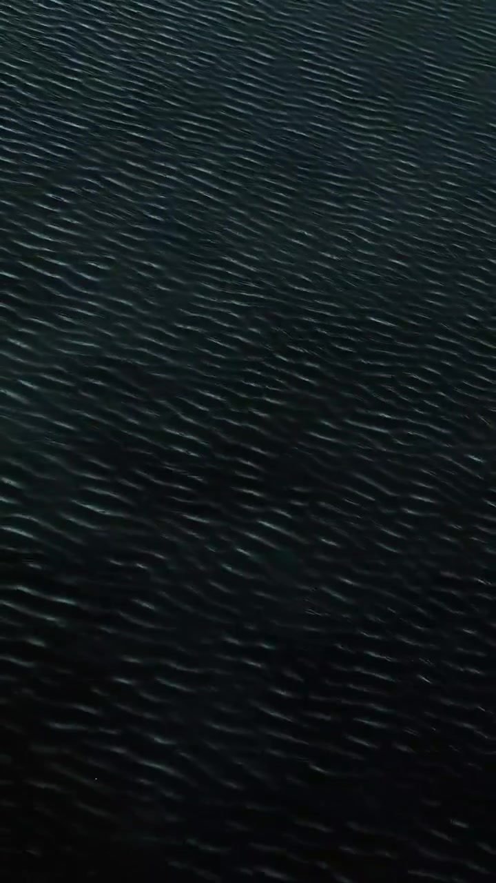 Dark Water Surface with Gentle Ripples
