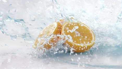 fresh water splash on a fresh juicy orange. shot on super slow motion camera 1000 fps.