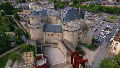 tilt up and receding aerial movement from the entrance side at the castle of the dukes of alencon, alencon, orne, france