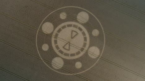 swarraton barley field geometric crop circle pattern aerial descending birdseye drone view above hampshire countryside