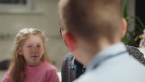 african-american teacher nods listening to student answer