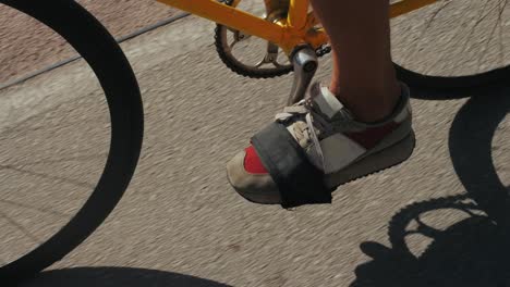 person riding a yellow bicycle