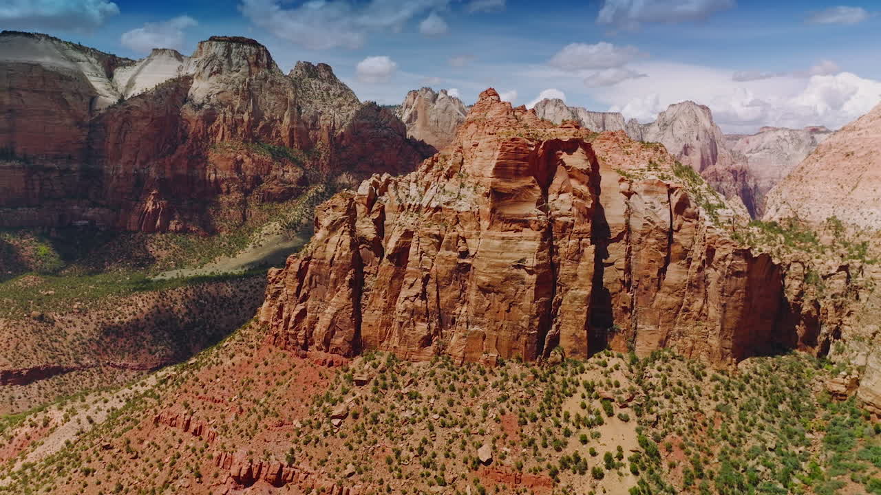 Bare lifeless mountains in the rays of hot sun. Amazing canyons of Utah State from aerial drone footage.