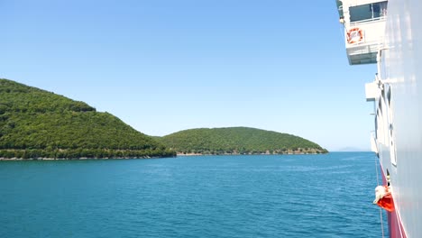 View-from-the-ferry-of-the-wooded-shore-of-a-Greek-island