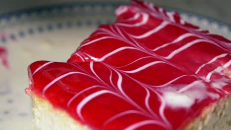 close-up of a slice of red and white iced cake