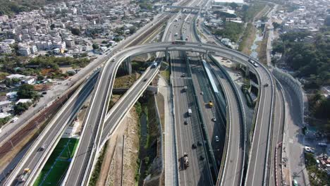 Traffic-on-a-Massive-highway-interchange-with-multiple-levels-and-loop-shaped-road-in-Hong-Kong,-Aerial-view