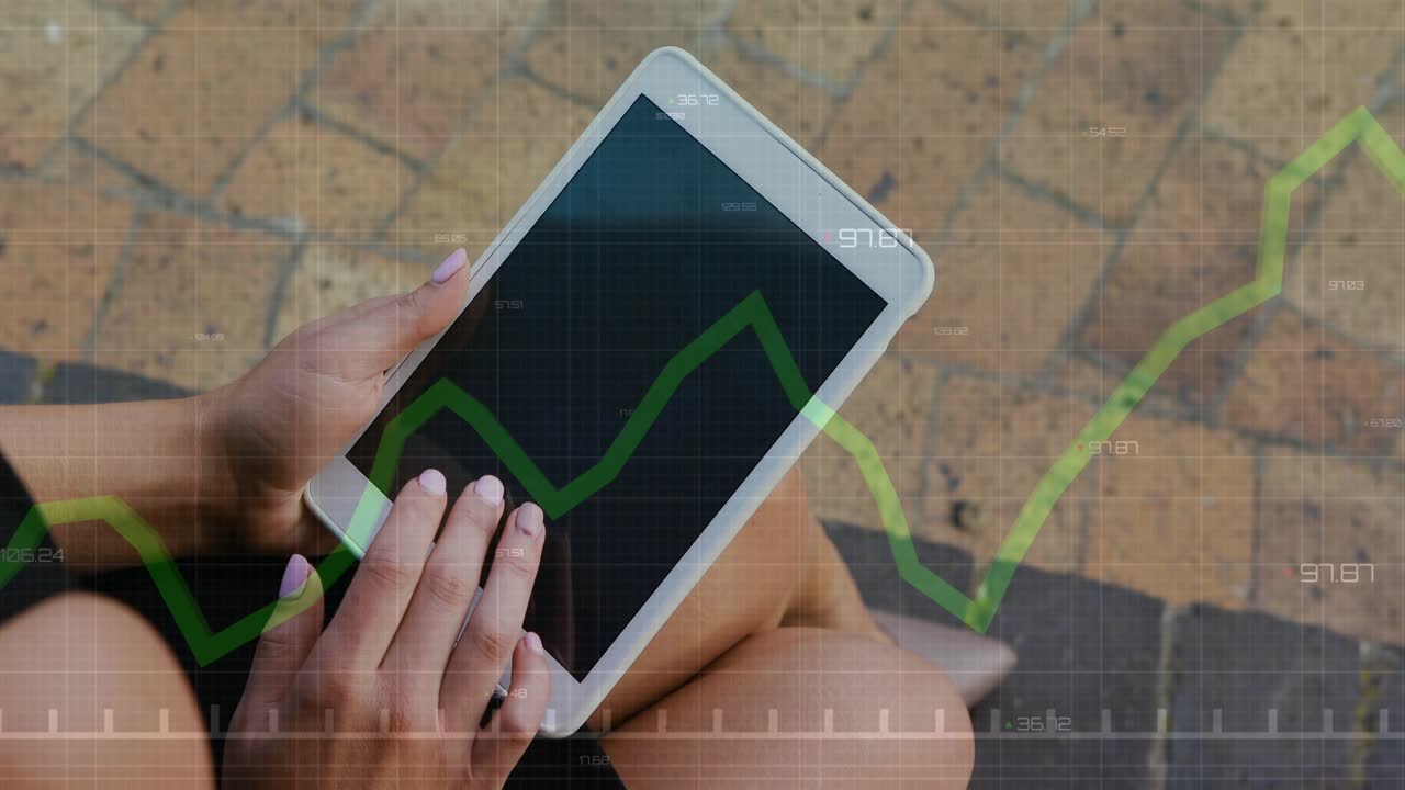 Woman tapping tablet on brick patio and revealing grid overlay with rising green finance chart
