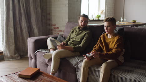 caucasian man and boy in the living room