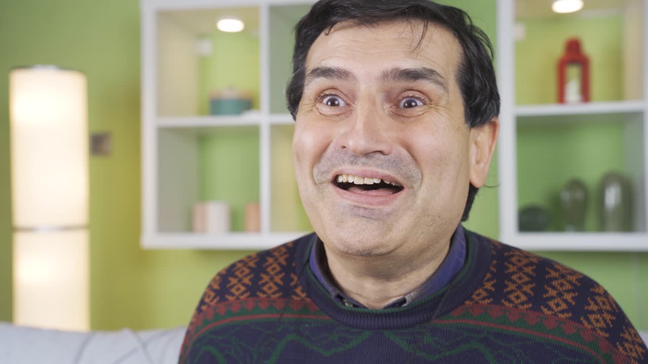 Mature man who gets good news and is happy.