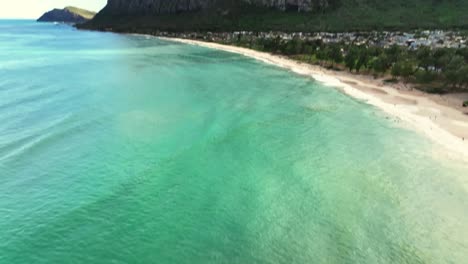 revealing shot of a small beach town with beautiful sceneries and backdrops