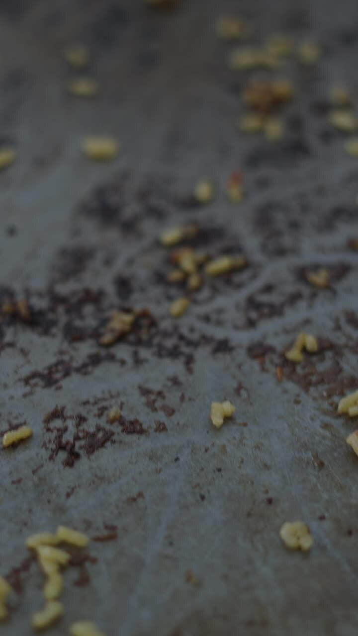 Scattered food crumbs on a surface