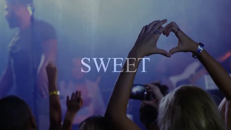 animation of sweet text over people dancing in the club