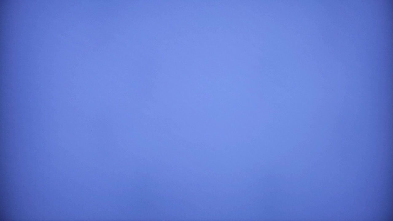 Real VHS capture: the start of a blank empty tape, from blue to black, with analog noise and distortion