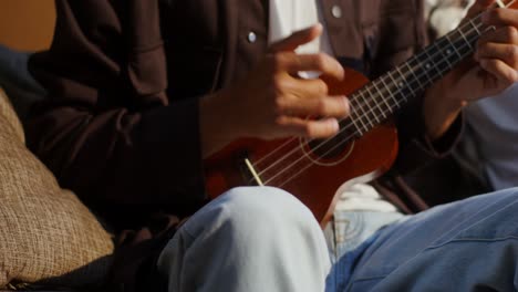 person playing ukulele