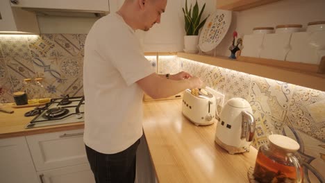 loving couple making a sandwich in kitchen-living room
