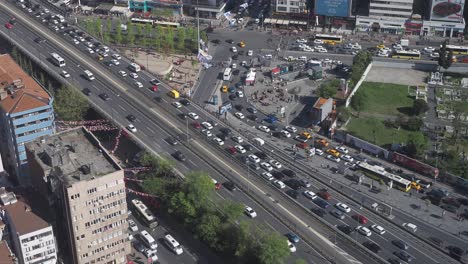 aerial view of busy istanbul street with traffic and cemetery