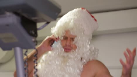 santa claus beats boxing bag angry santa claus santa claus kickboxer training in the gym the concept of sport