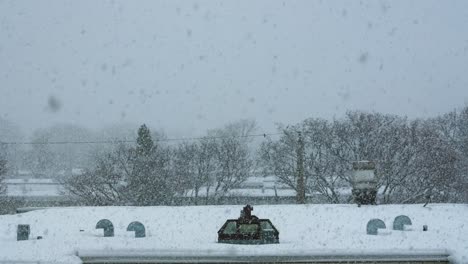 slow motion of snow blizzard over city building roof exterior day