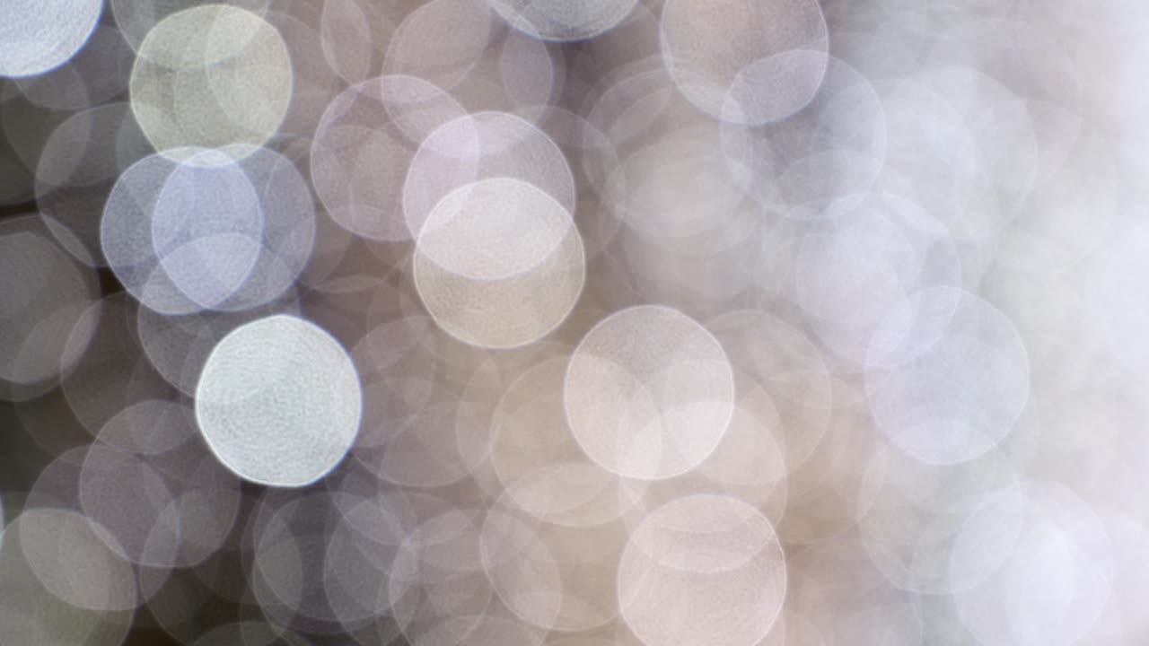 Blurred white Christmas lights on a wall