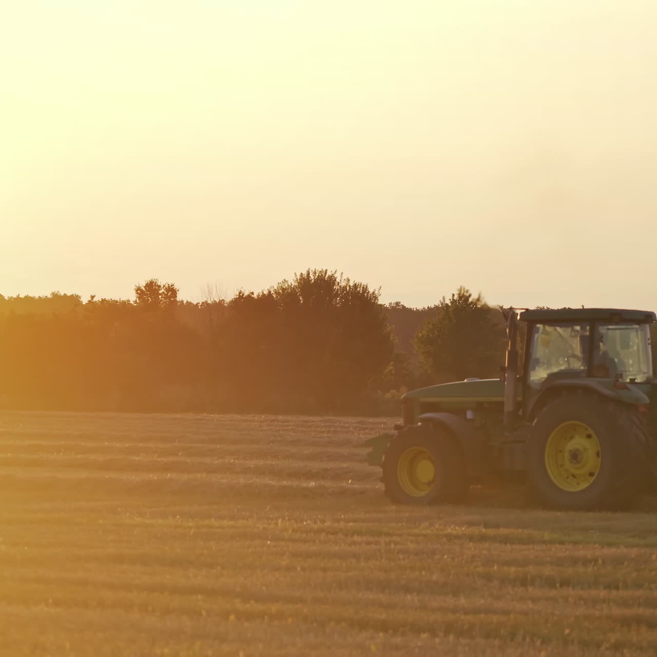 Baling haystack with a hay baler