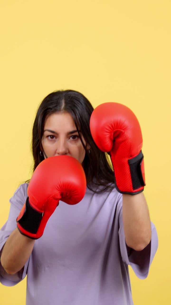 Woman Training with Red Boxing Gloves