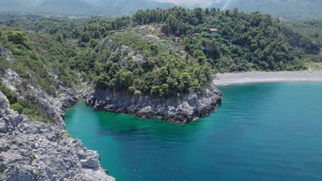 drone reveal scenic cliff stone formation in evoia island greece lonely beach travel holiday summer destination in europe