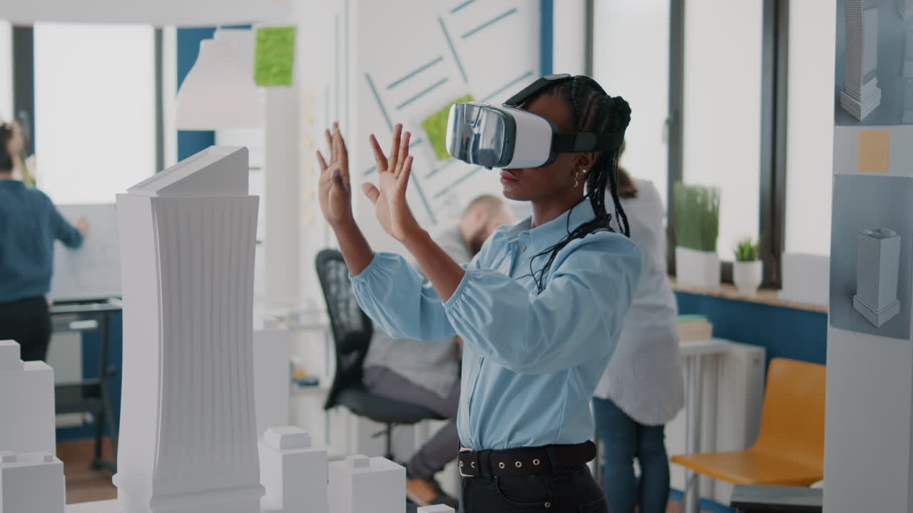Woman uses VR to design architecture in office