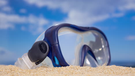 a snorkel mask on the beach